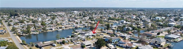 bird's eye view featuring a residential view and a water view