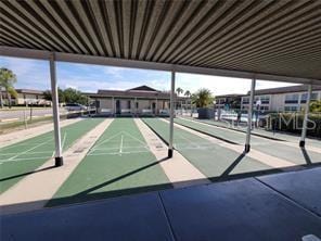 view of property's community featuring shuffleboard