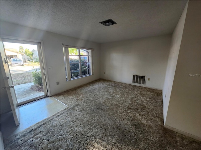 interior space with visible vents and a textured ceiling