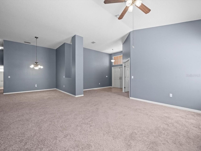 unfurnished room featuring visible vents, baseboards, carpet, lofted ceiling, and a ceiling fan