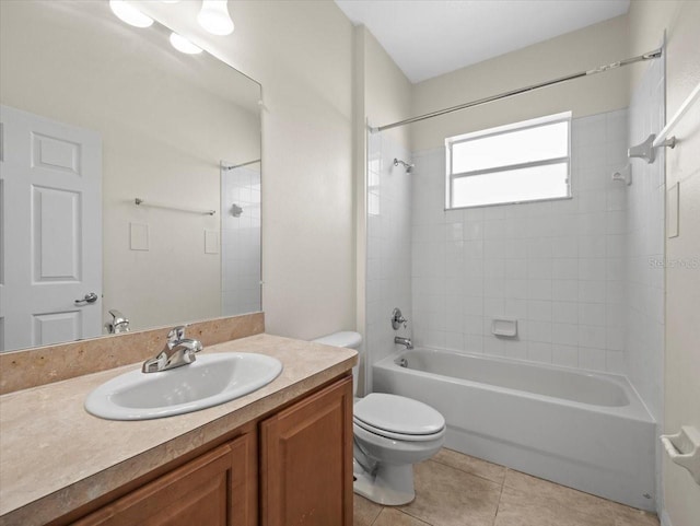 full bathroom with tile patterned flooring, toilet, vanity, and shower / bath combination