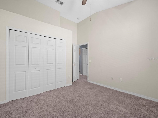 unfurnished bedroom featuring a closet, visible vents, baseboards, and carpet floors