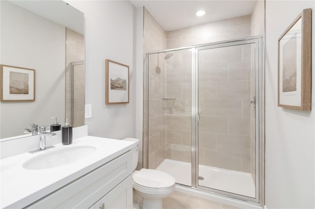 full bathroom featuring recessed lighting, a shower stall, toilet, and vanity