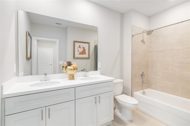 full bath featuring a sink, toilet, double vanity, and shower / bathtub combination