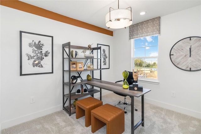 office featuring baseboards and light colored carpet