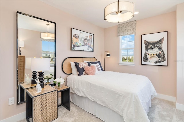 carpeted bedroom with baseboards