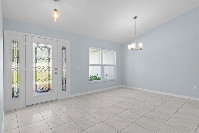 foyer entrance with an inviting chandelier, baseboards, and lofted ceiling