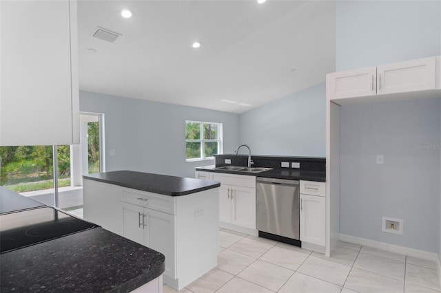 kitchen featuring visible vents, white cabinetry, a peninsula, a sink, and dishwasher