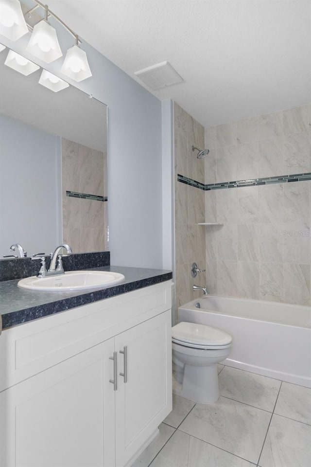 bathroom with visible vents, toilet, marble finish floor, shower / bathing tub combination, and vanity