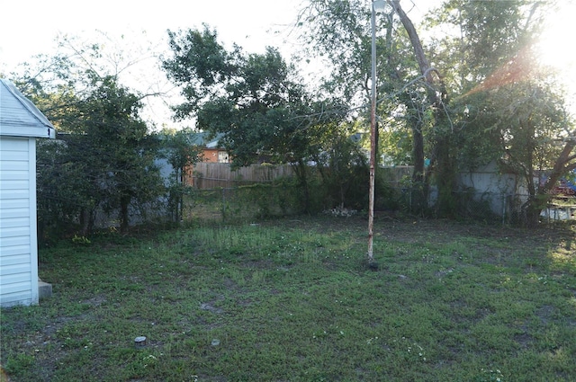 view of yard with a fenced backyard