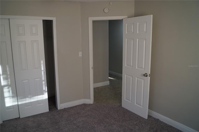 unfurnished bedroom with baseboards and carpet floors