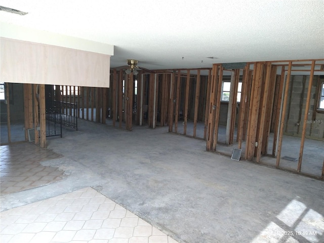 below grade area featuring a ceiling fan