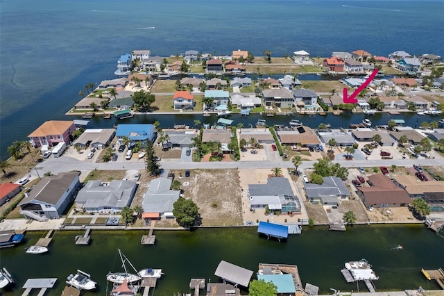 birds eye view of property featuring a residential view and a water view