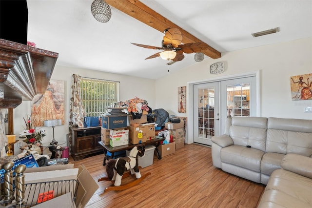 living area featuring a ceiling fan, visible vents, vaulted ceiling with beams, light wood-style floors, and french doors