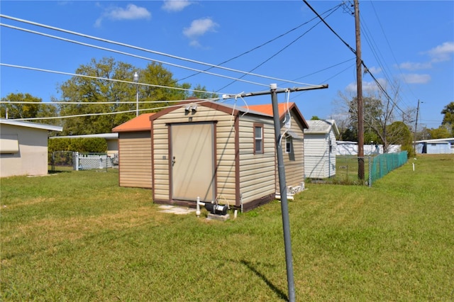 view of shed with fence