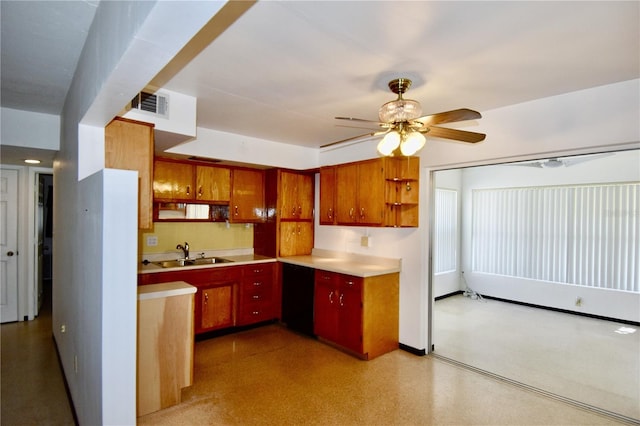 kitchen featuring visible vents, a sink, light countertops, a ceiling fan, and open shelves