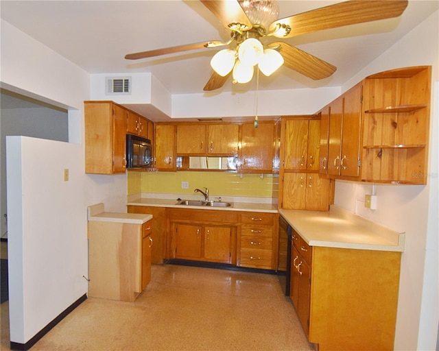 kitchen with a ceiling fan, visible vents, a sink, black appliances, and brown cabinets