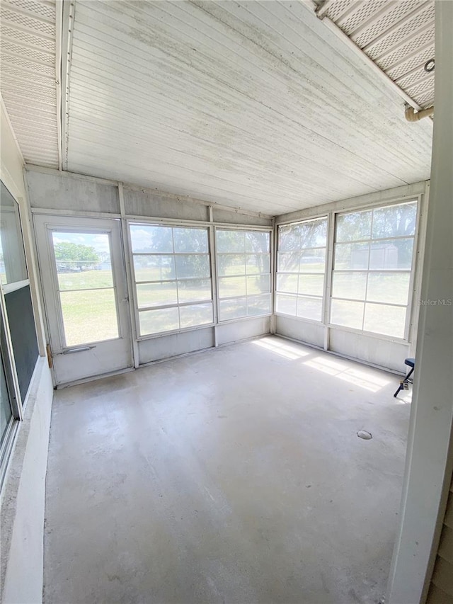 unfurnished sunroom featuring a healthy amount of sunlight