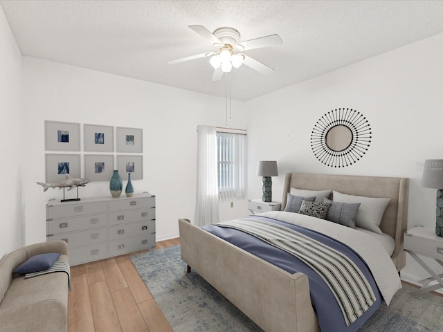 5557 Sea Forest Dr Unit 318, New Port Richey, FL 34652 - bedroom with a textured ceiling, ceiling fan, and wood finished floors