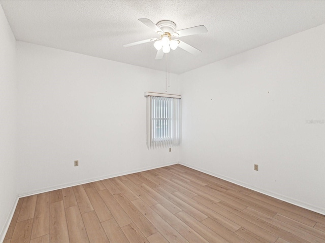 5557 Sea Forest Dr Unit 318, New Port Richey, FL 34652 - empty room with baseboards, a textured ceiling, light wood-style floors, and ceiling fan