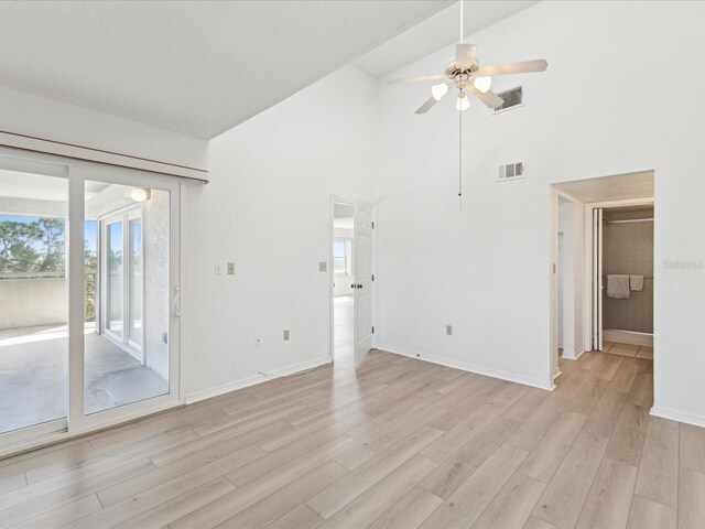 5557 Sea Forest Dr Unit 318, New Port Richey, FL 34652 - unfurnished living room with baseboards, visible vents, light wood-style flooring, and ceiling fan