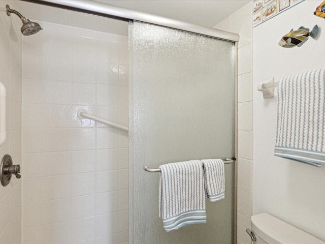 5557 Sea Forest Dr Unit 318, New Port Richey, FL 34652 - bathroom with a stall shower and toilet