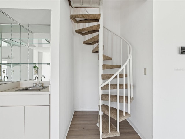 5557 Sea Forest Dr Unit 318, New Port Richey, FL 34652 - staircase with baseboards and wood finished floors