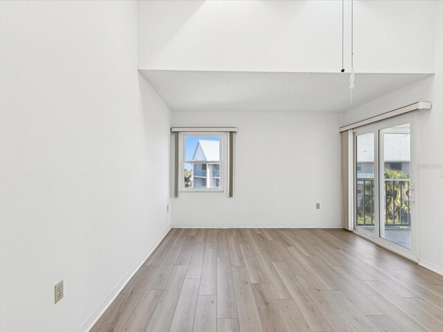 5557 Sea Forest Dr Unit 318, New Port Richey, FL 34652 - empty room featuring baseboards and light wood finished floors