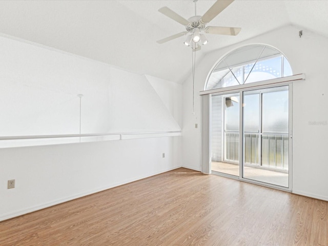 5557 Sea Forest Dr Unit 318, New Port Richey, FL 34652 - unfurnished room featuring baseboards, lofted ceiling, wood finished floors, and a ceiling fan