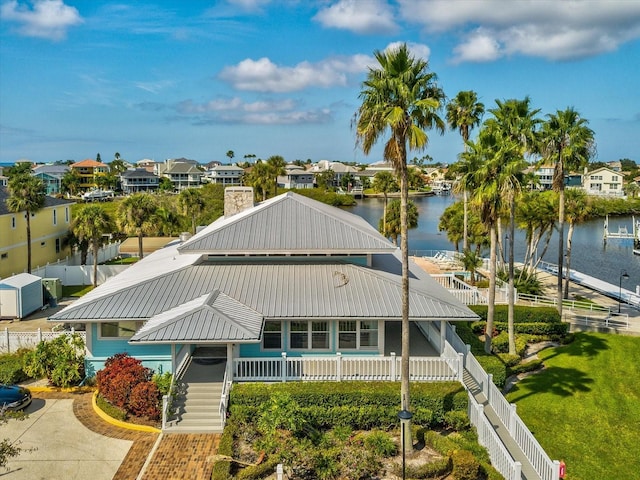 5557 Sea Forest Dr Unit 318, New Port Richey, FL 34652 - view of property with a water view, fence private yard, and a residential view