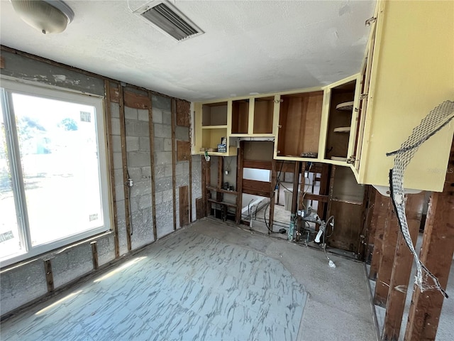 13930 Berkowitz Ave, Hudson, FL 34667 - empty room featuring a textured ceiling