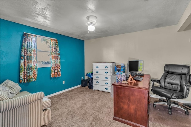 office with carpet flooring, ceiling fan, a textured ceiling, and baseboards