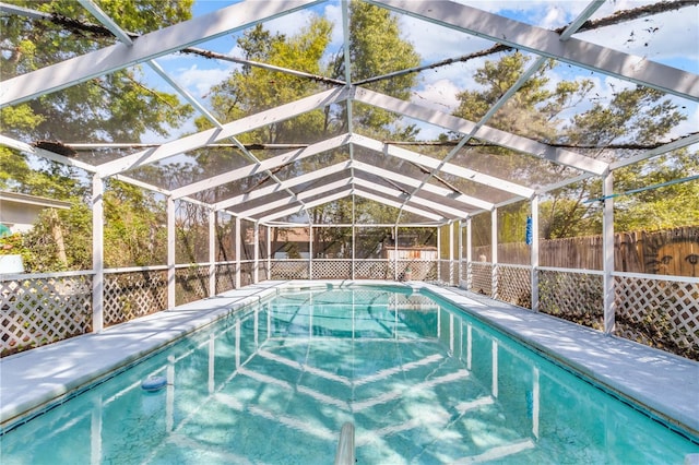 view of pool featuring a lanai, a fenced in pool, and a fenced backyard