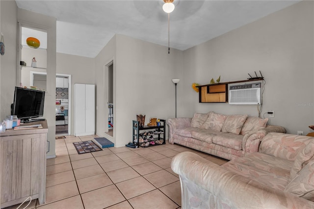 living room featuring light tile patterned floors, a ceiling fan, and a wall mounted air conditioner