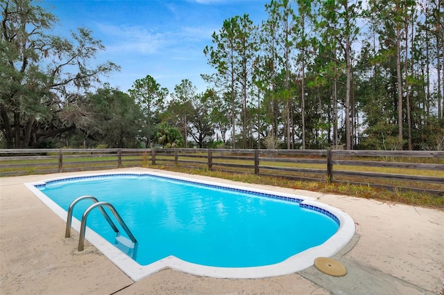 view of pool featuring a fenced in pool and fence