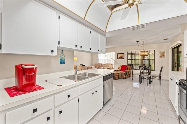 kitchen with visible vents, ceiling fan with notable chandelier, a sink, stainless steel appliances, and light countertops