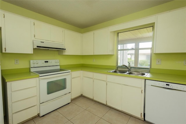 kitchen featuring a sink, white appliances, light countertops, light tile patterned floors, and extractor fan