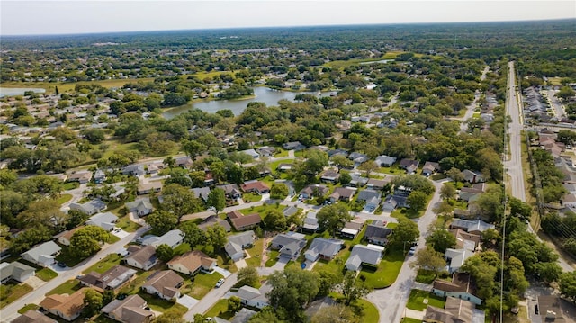 bird's eye view featuring a residential view and a water view
