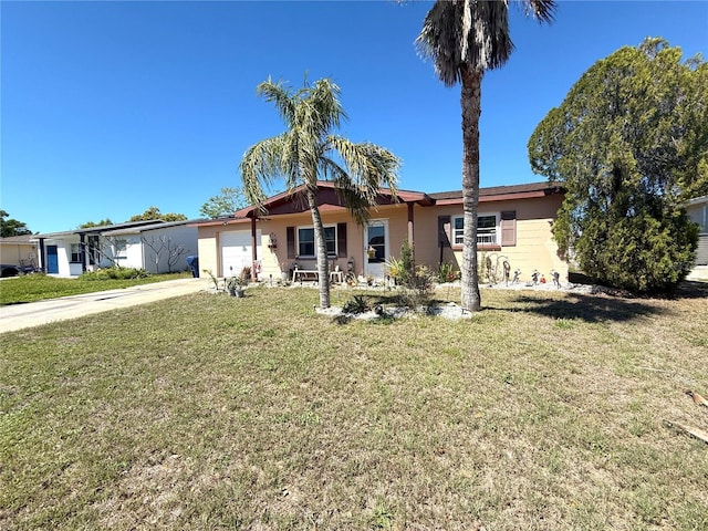 ranch-style home with concrete driveway, an attached garage, and a front yard