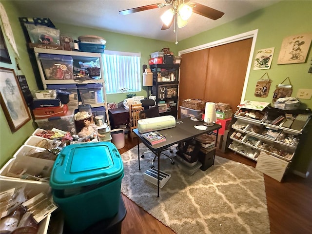 home office featuring a ceiling fan and wood finished floors