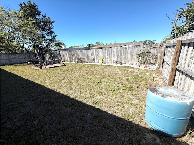 view of yard with a fenced backyard
