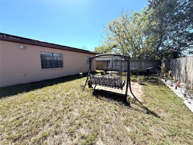 view of yard featuring a fenced backyard and a patio area