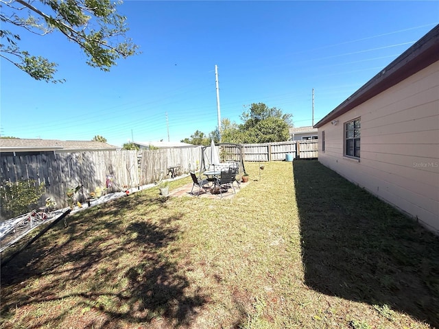 view of yard with a fenced backyard