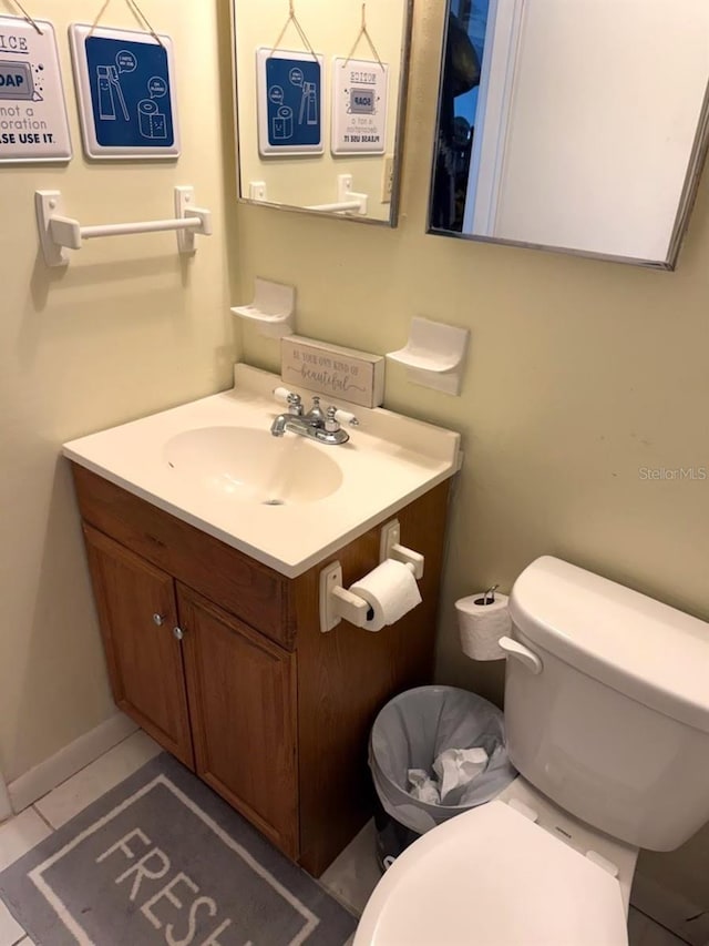 half bathroom with toilet and vanity