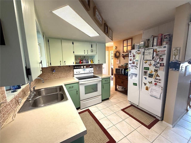 8053 Hixton Dr, Port Richey, FL 34668 - kitchen with green cabinetry, white appliances, a sink, open shelves, and light countertops