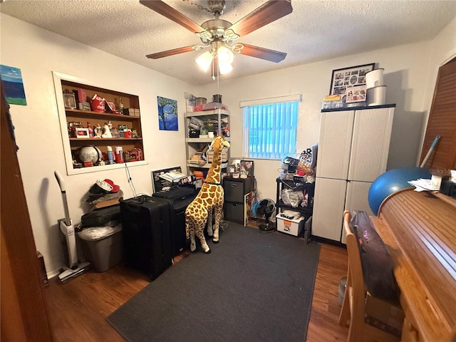 8053 Hixton Dr, Port Richey, FL 34668 - office area with wood finished floors, a ceiling fan, and a textured ceiling