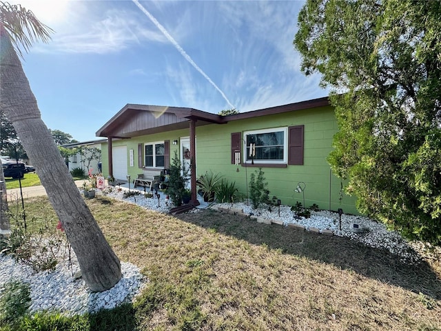8053 Hixton Dr, Port Richey, FL 34668 - view of front of property with a front yard and covered porch