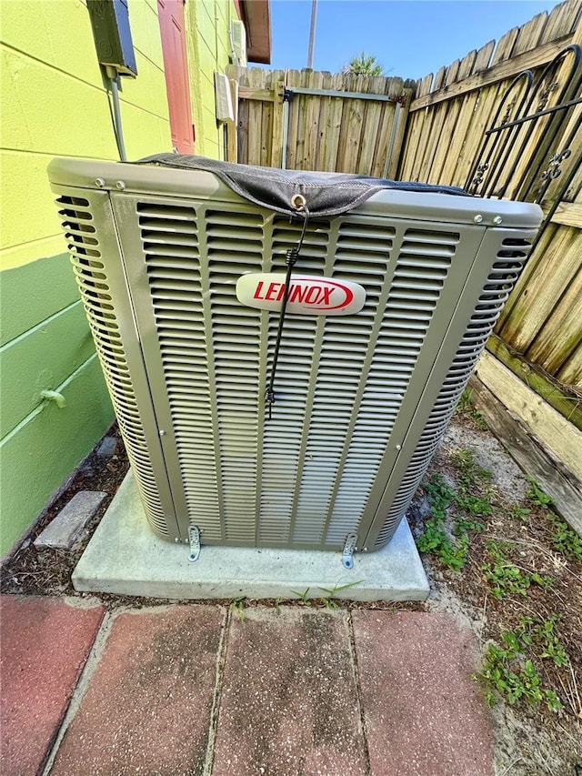 8053 Hixton Dr, Port Richey, FL 34668 - exterior view of concrete block siding and central AC unit