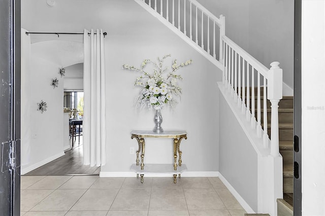 11895 Crestridge Loop, New Port Richey, FL 34655 - staircase featuring tile patterned floors and baseboards