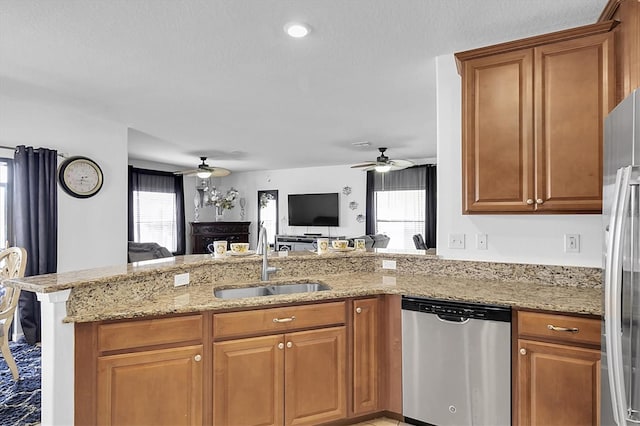 11895 Crestridge Loop, New Port Richey, FL 34655 - kitchen featuring a sink, stainless steel appliances, a healthy amount of sunlight, and ceiling fan